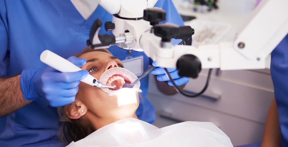 Woman having procedure done at dentist