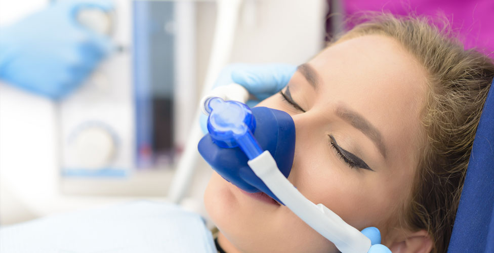 Woman undergoing sedation dentistry